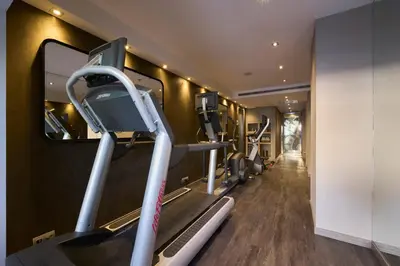a gym with treadmills and a treadmill at Catalonia Square 4* Sup in Barcelona