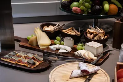 a bakery with bread and pastries on a counter at Catalonia Square 4* Sup in Barcelona