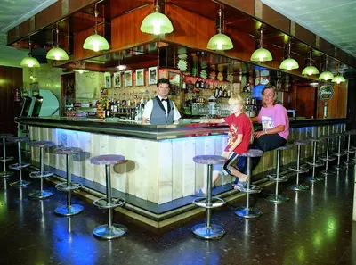 a group of people sitting at a bar at HOTEL CONTINENTAL in Calella
