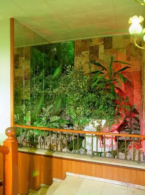 a mural of a garden on a wall at HOTEL CONTINENTAL in Calella