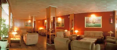 a salon with chairs and a waiting room at HOTEL CONTINENTAL in Calella