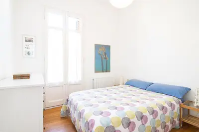 a bedroom with a bed with a polka dot blanket at Barcelona cozy apartment in Barcelona