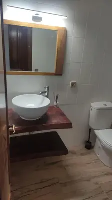 a bathroom with a sink and a toilet at SITGES Apartment PALLARÉS in Sitges