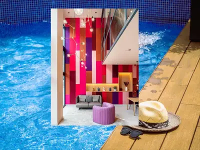 a room with a pool with a hat and a couch at ARCELON HOTEL - From 2023 in Barcelona