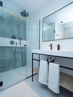 a person swimming in a swimming pool with a hat at ARCELON HOTEL - From 2023 in Barcelona