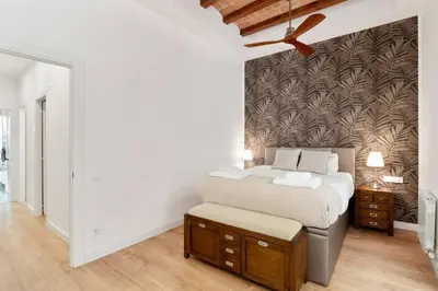 a white kitchen with a sink and a microwave at The Collection Barcelona - Arc de Triomf Luxury Modern 2-Bedroom 2-Bathroom in Barcelona