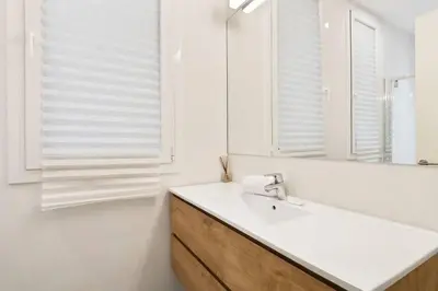 a white room with white walls and a window at The Collection Barcelona - Arc de Triomf Luxury Modern 2-Bedroom 2-Bathroom in Barcelona