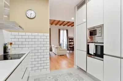 a bedroom with a bed with two towels on it at The Collection Barcelona - Arc de Triomf Luxury Modern 2-Bedroom 2-Bathroom in Barcelona
