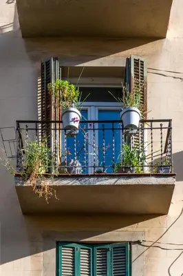 a room with two chairs and a table and a window at The Collection Barcelona - Sagrada Familia- Emblematic and Charming Catalan Home in Barcelona