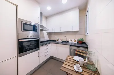 a bathroom with a toilet and a sink and a shower at The Collection Barcelona - Comfortable 3-bedroom next to Sagrada Familia in Barcelona