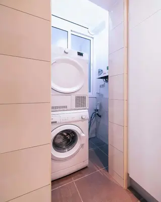 a kitchen counter with a sink and four pictures on it at The Collection Barcelona - Comfortable 3-bedroom next to Sagrada Familia in Barcelona