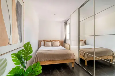 a white bathroom with a toilet and a shower at The Collection Barcelona - Amazing 3 bedroom penthouse in Plaza España in Barcelona