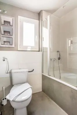 a hallway with a room with a bed and a mirror at The Collection Barcelona - Amazing 3 bedroom penthouse in Plaza España in Barcelona