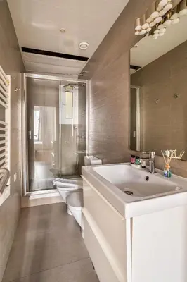 a bathroom with a sink and a toilet at The Collection Barcelona - Stylish and centric 2-bedroom apartment with Terrace in Eixample in Barcelona