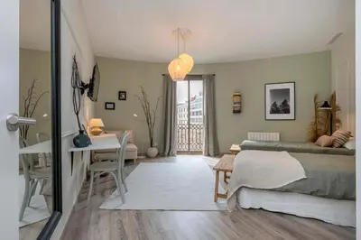a bedroom with a bed and a table and a desk at The Collection Barcelona - Luxury 4-bedrooms in Rambla de Catalunya in Barcelona