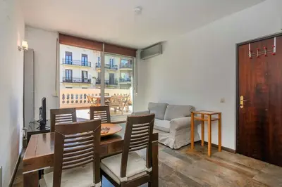 a living room with a couch and a table at The Collection Barcelona -3BD with private terrace right by Sagrada Familia in Barcelona