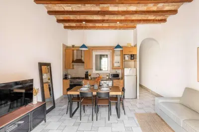 a bedroom with a bed and a glass closet at The Collection Barcelona - Historic apartment with private terrace in Example in Barcelona
