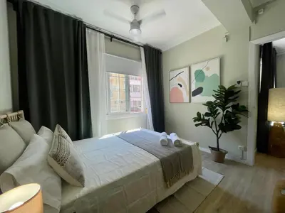 a bedroom with a large bed and a window at The Collection Barcelona - Poble Sec - Modern & comfy 3 bedrooms in Barcelona