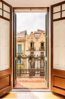 an open door with a view of a building at The Collection Barcelona - Exclusive Luxe Design - Large Tranquil Penthouse in Barcelona
