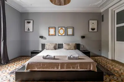a bedroom with a bed with two towels on it at The Collection Barcelona - Ronda Sant Pere in Barcelona