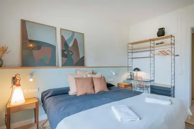a bedroom with a large bed with blue sheets at The Collection Barcelona - Exclusive Paseo de Gracia 5BD 5BTH with terrace in Barcelona