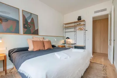 a bedroom with a large bed in a room at The Collection Barcelona - Exclusive Paseo de Gracia 5BD 5BTH with terrace in Barcelona