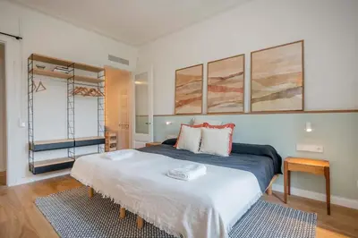 a bedroom with a large bed in a room at The Collection Barcelona - Exclusive Paseo de Gracia 5BD 5BTH with terrace in Barcelona