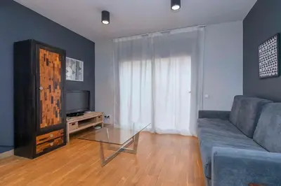 a hallway with a brick walkway between two buildings at The Collection Barcelona - Bright and modern Duplex with terrace in Eixample district P1 in Barcelona