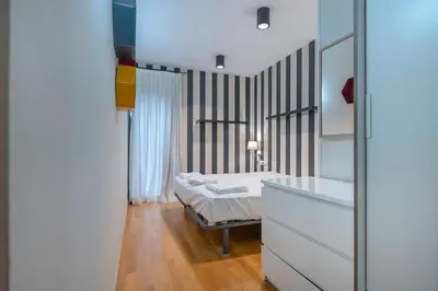 a large mirror on a dresser in a room at The Collection Barcelona - 2 bedroom Duplex apartment with balcony 4-3 in Barcelona