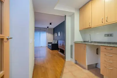 a bedroom with a bed with a lamp and a window at The Collection Barcelona - 2 bedroom with balcony in Eixample 4-2 in Barcelona