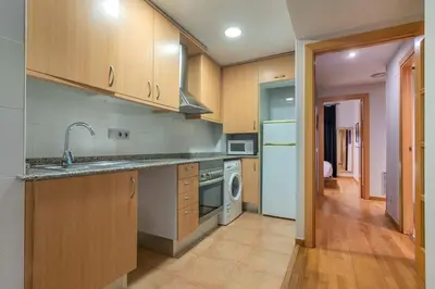 a bathroom with a white sink and a shower at The Collection Barcelona - 2 bedroom with balcony in Eixample 4-2 in Barcelona
