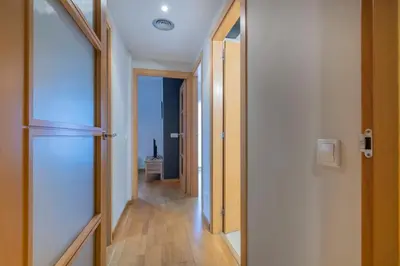 a living room with a couch and a table and a window at The Collection Barcelona - Modern and bright apartment in Eixample 5-1 in Barcelona