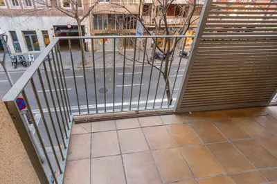 an open gate in a building with a street at The Collection Barcelona - Modern and bright apartment in Eixample 1-3 in Barcelona