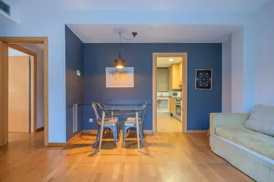 a living room with a table and a couch at The Collection Barcelona - Modern and bright apartment in Eixample 2-1 in Barcelona