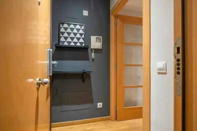 a small room with two beds and a mirror at The Collection Barcelona - Modern and bright apartment in Eixample 2-1 in Barcelona