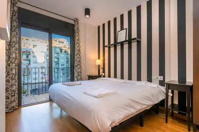 a bathroom with a white toilet and a sink at The Collection Barcelona - Modern and bright apartment in Eixample 3-1 in Barcelona
