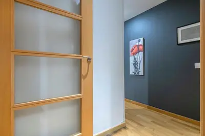 a closet with glass shelves in a room at The Collection Barcelona - 2 bedroom with balcony in Eixample 3-2 in Barcelona