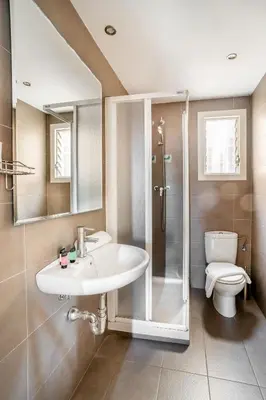a bathroom with a sink and a shower and a toilet at The Collection Barcelona - Big apartment for 15 in the heart of Eixample in Barcelona