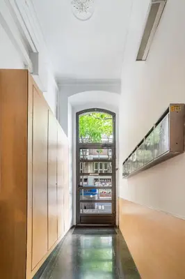 a hallway with an open door to a building at The Collection Barcelona - Pl Universitat Comfortable 3BD with private patio in Barcelona
