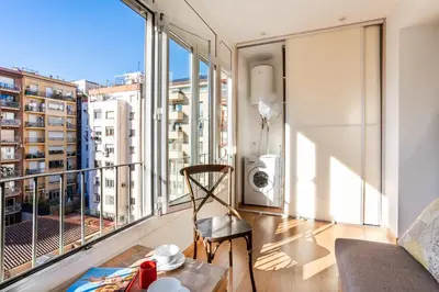 a white bathroom with a toilet and a sink at The Collection Barcelona - Modernist and Luxurious flat - Casa de Flor in Barcelona