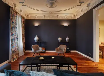 a living room with a table and two chairs at The Collection Barcelona - Classy 3BD - 2BTH with private patio in Eixample in Barcelona