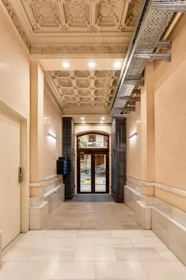 an empty hallway in a building with a ceiling at The Collection Barcelona - Perfectly located 4bed 4bath apartment in Eixample in Barcelona