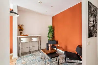 a living room with a table and chairs at The Collection Barcelona - Very Spacious Eixample 4bd 4ba apartment in Barcelona