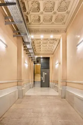 an empty hallway with a door in a building at The Collection Barcelona - Very Spacious Eixample 4bd 4ba apartment in Barcelona