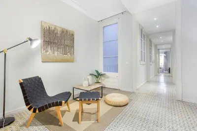 a quotationatory logo with a white background at The Collection Barcelona - 4bedroom apartment with a balcony in Las Ramblas 1 2 in Barcelona