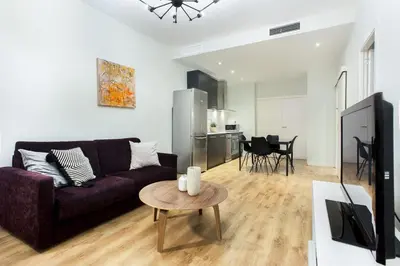 a bedroom with a large bed and a window at The Collection Barcelona - Centric 3bedroom in Las Ramblas 2 1B in Barcelona
