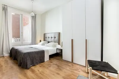 a kitchen with a table and chairs in a room at The Collection Barcelona - Centric 3bedroom in Las Ramblas 2 1B in Barcelona
