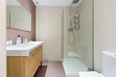 a bathroom with a sink and a toilet at The Collection Barcelona - 4 bedroom apartment with a balcony in Las Ramblas 2 2 in Barcelona