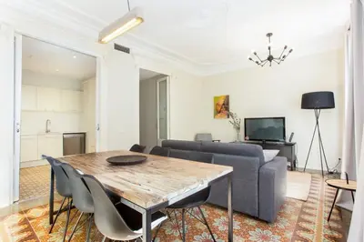a white kitchen with white cabinets and a sink at The Collection Barcelona - 4 bedroom apartment with a balcony in Las Ramblas 2 2 in Barcelona