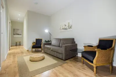 a living room with a glass table and chairs at The Collection Barcelona - Bright and modern 4bedroom with terrace in Las Ramblas P2 in Barcelona